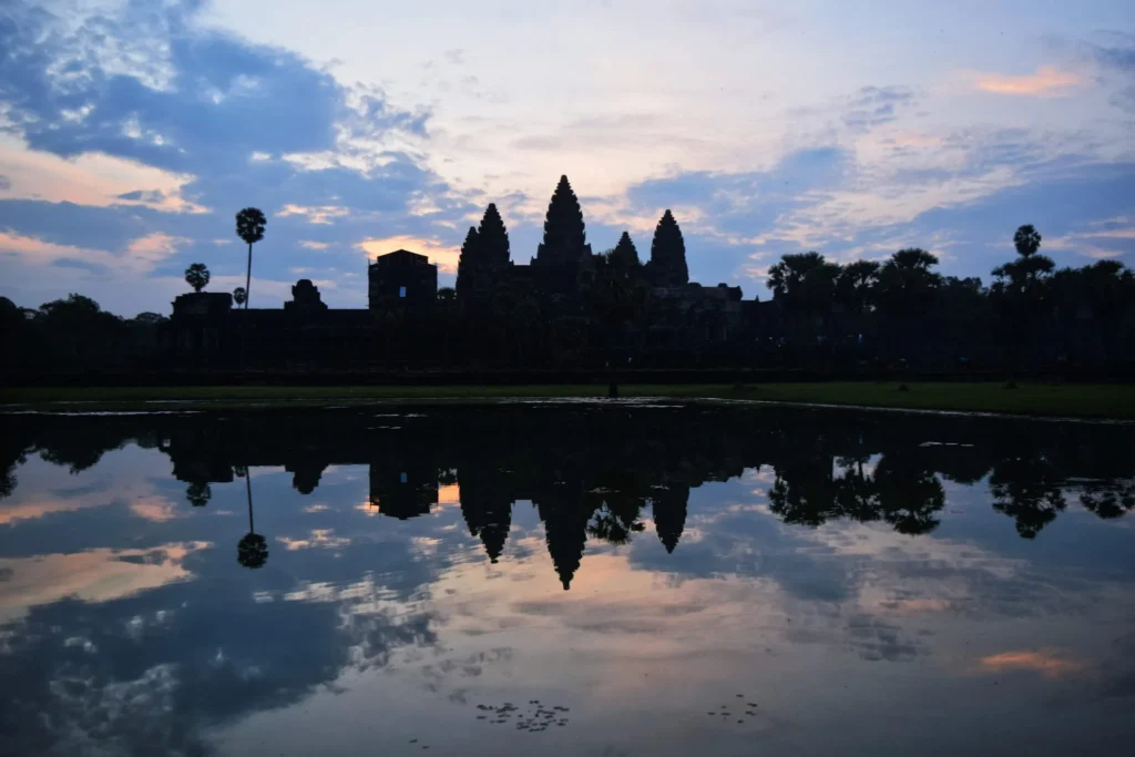 angkor wat sunrise over the main temple, one of the best things to do when touring angkor wat cambodia