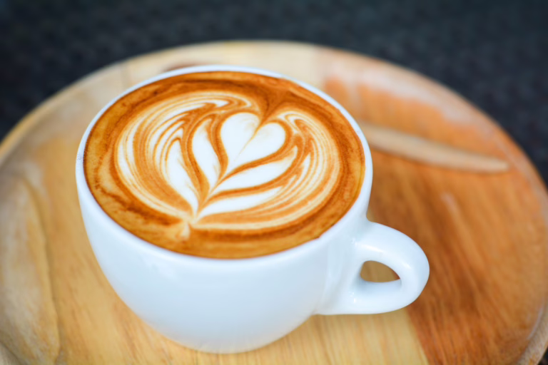 latte sitting on a wooden table, a common sight at the best coffee shops in savannah ga